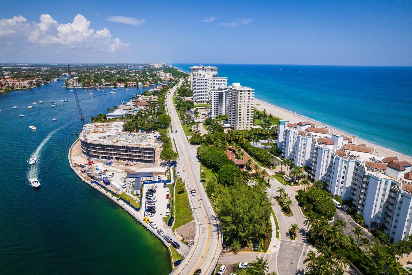 Aerial view of Boca Raton beach and ocean, showcasing sandy shores and vibrant blue waters under a clear sky.