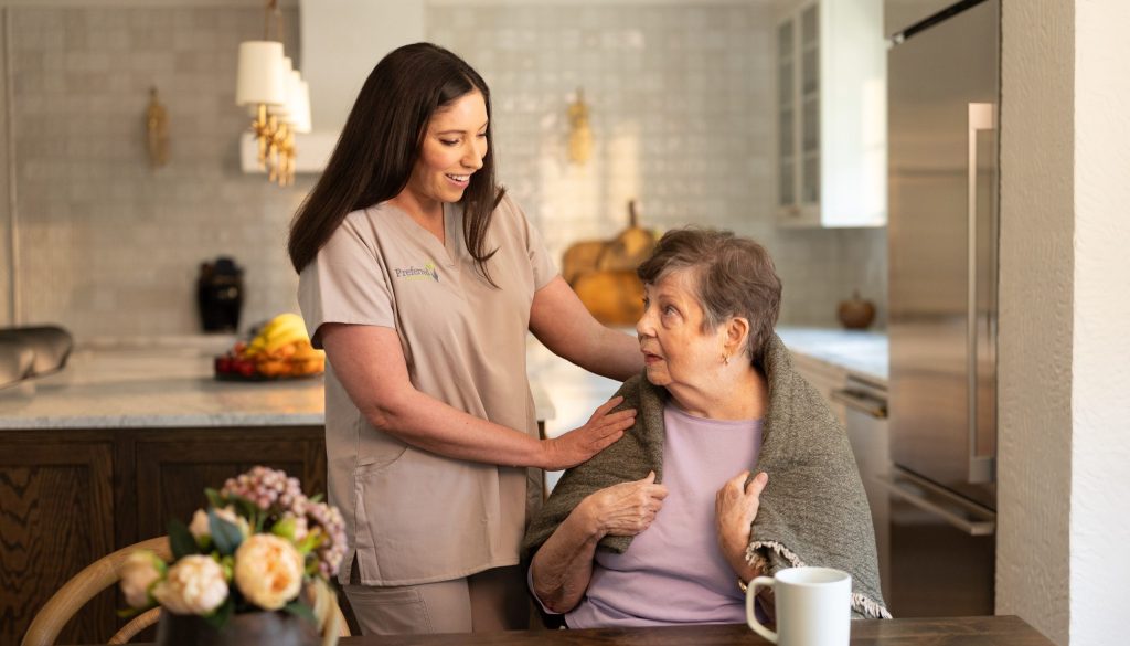 Preferred Care at Home caregiver with a senior in the kitchen