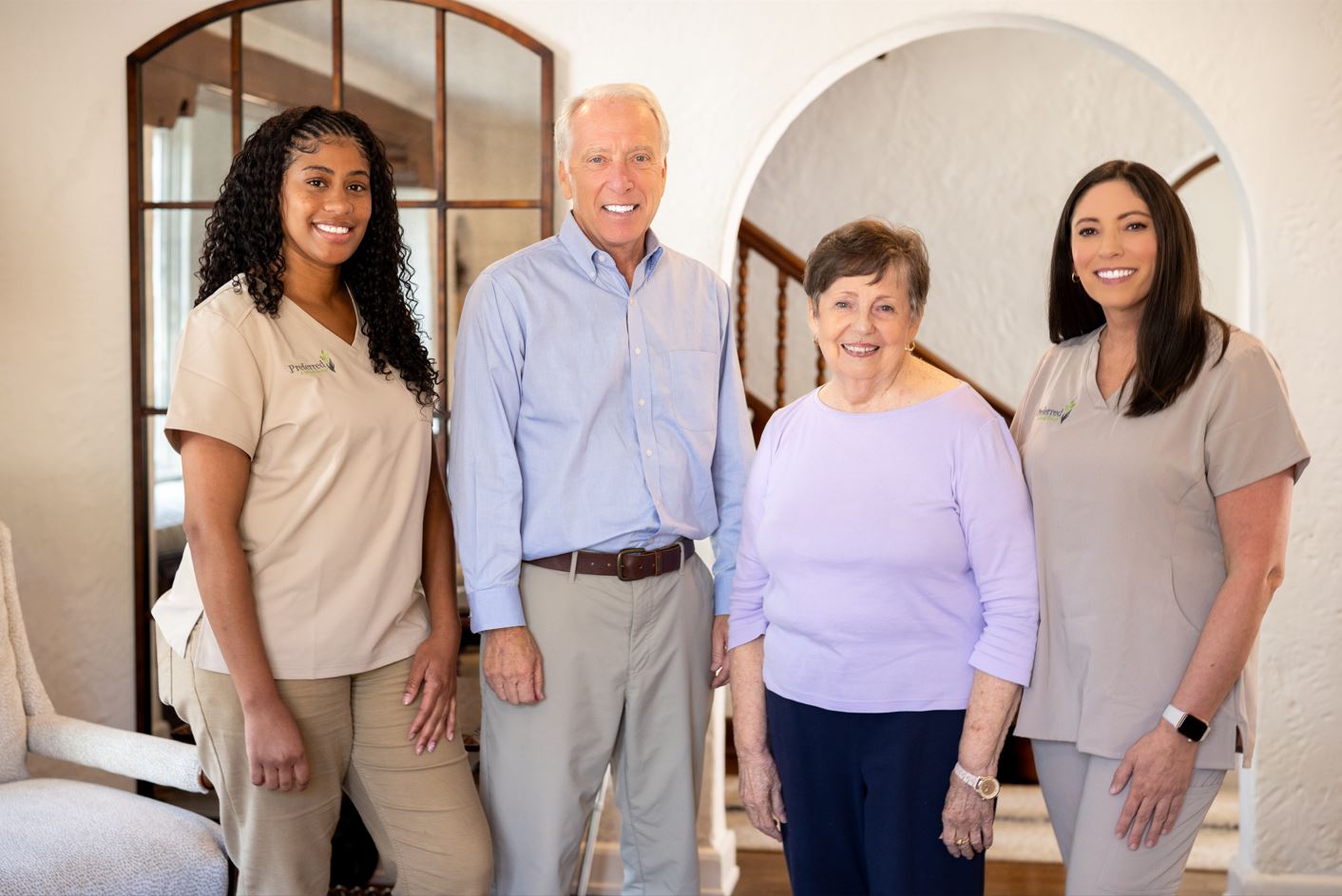Staff members of the home care agency pose together, showcasing their teamwork and commitment to providing care services.