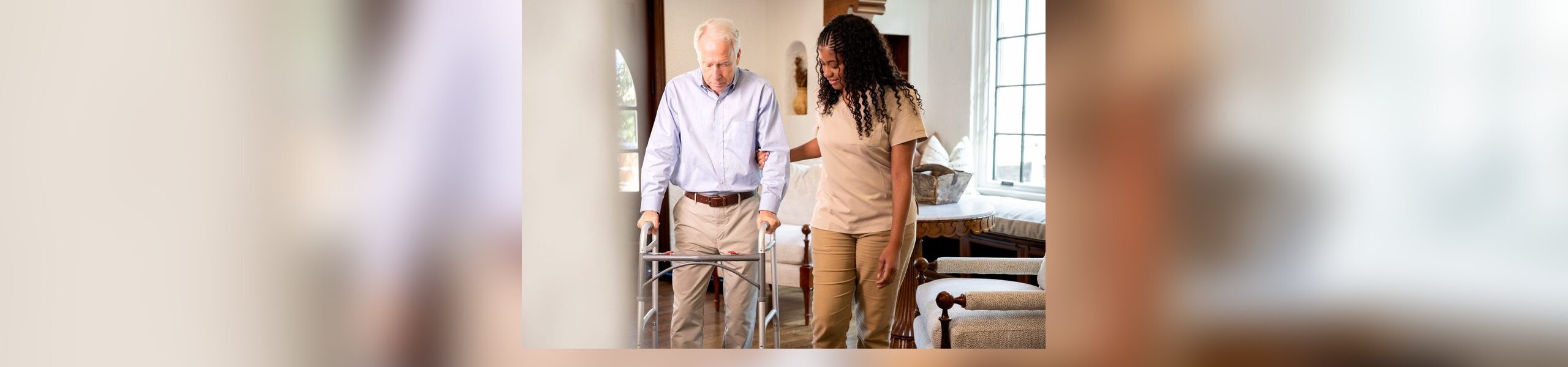 Caregiver supporting senior with walker