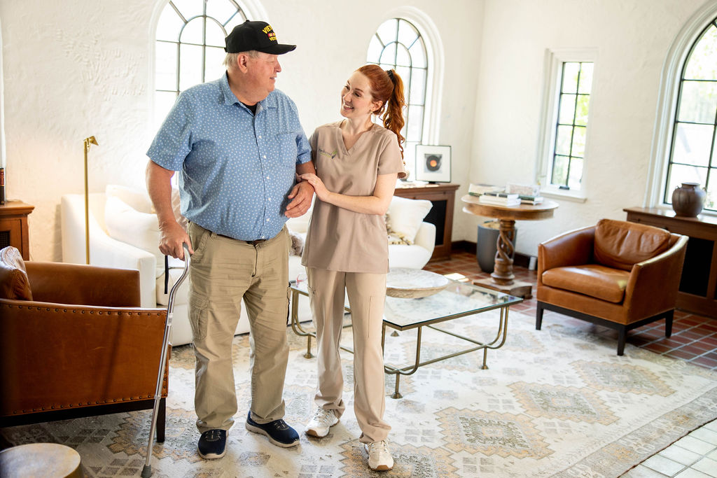 Preferred Care at Home caregiver helping a senior stay comfortable indoors